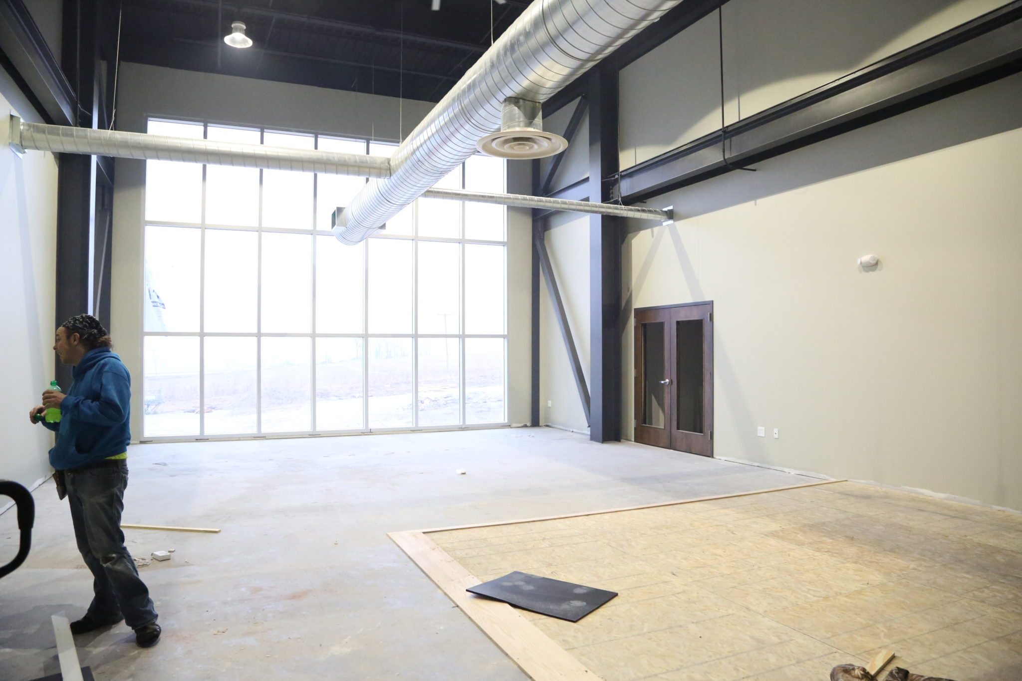 The main space in the gym, with floor to ceiling windows.