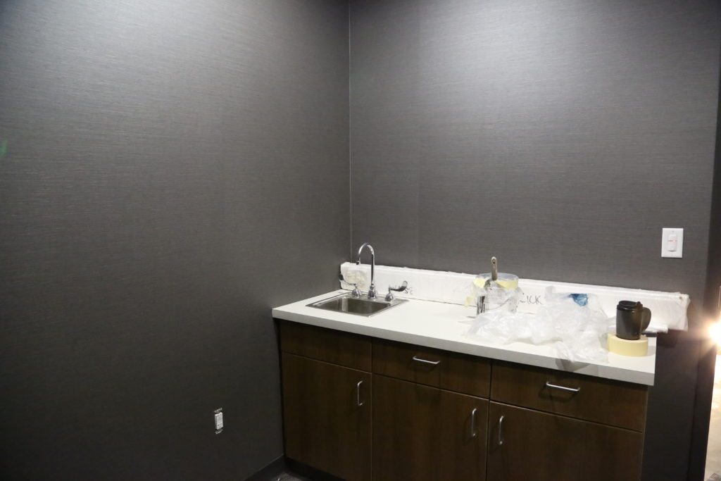 The therapy room has a nice calming grey color to help relax employees.