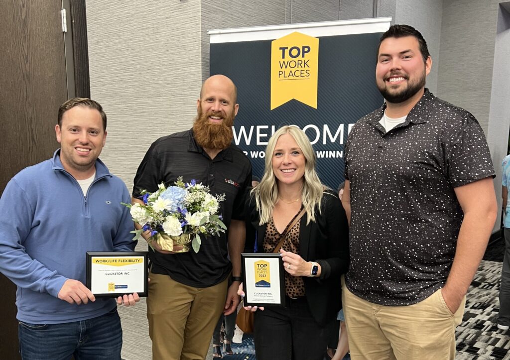 Four members of Clickstop's Leadership Team receiving the #12 Top Workplace in Iowa and top honor in Work/Life Balance.