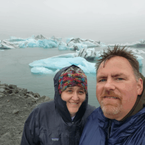 Bill and his wife with glaciers in Iceland
