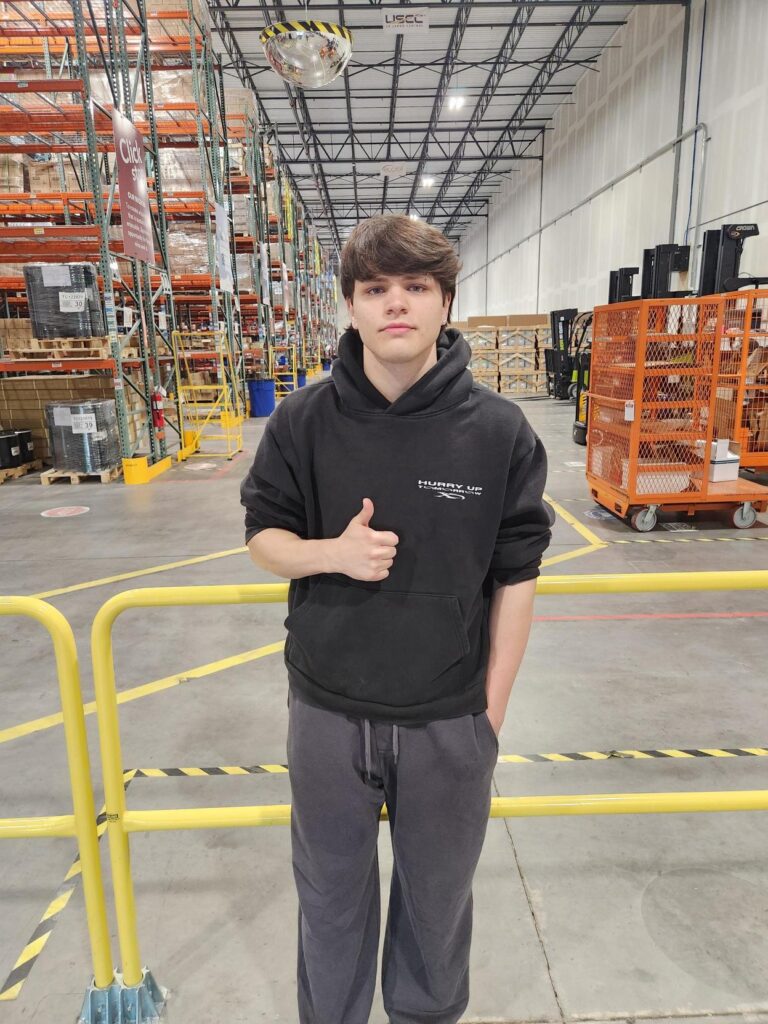 Landon Burns at our East Coast Distribution Center with the warehouse in the background